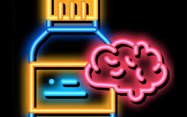 Een medicijnflesje en een brein in neon.