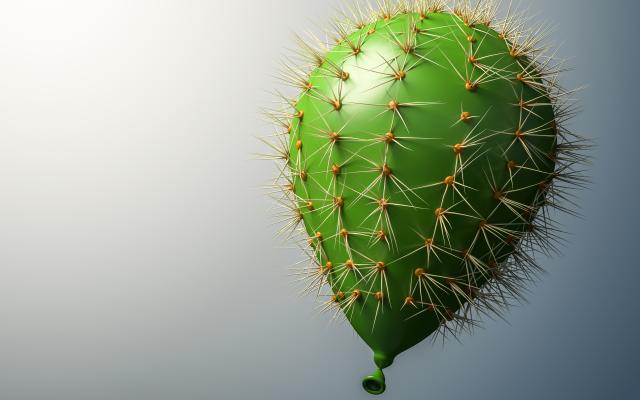 Een groene ballon met de stekels van een cactus.