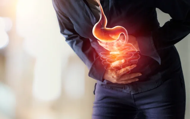 Persoon met buikpijn