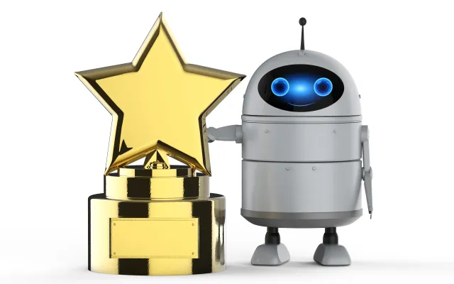 Een robot naast een trofee