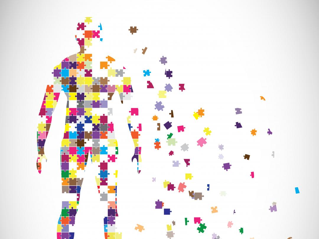 Afbeelding van een mens bestaand uit puzzelstukjes.