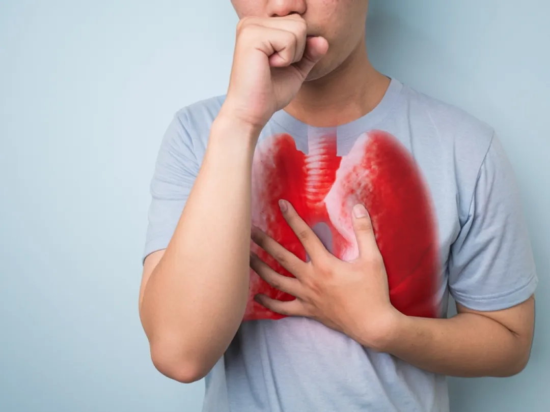 Hoestend persoon met illustratie van rode longen