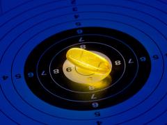 Een gele pil ligt in het midden (bullseye) van een doelwit.