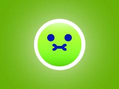 Een groene, misselijke emoji.