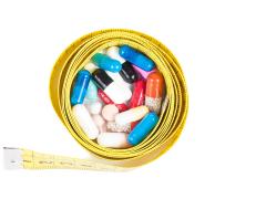 Een meetlint om een aantal pillen heen