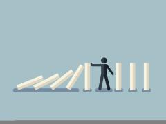 Illustratie van een mannetje dat omvallende blokken tegenhoudt